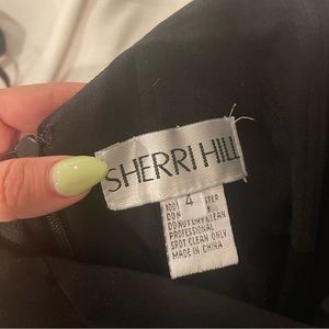 Sherri Hill black gown off the shoulder size 4. Dress was tailored shorter